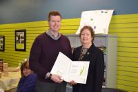 Jeff accepts a certificate from Mayor Sue Paterson
